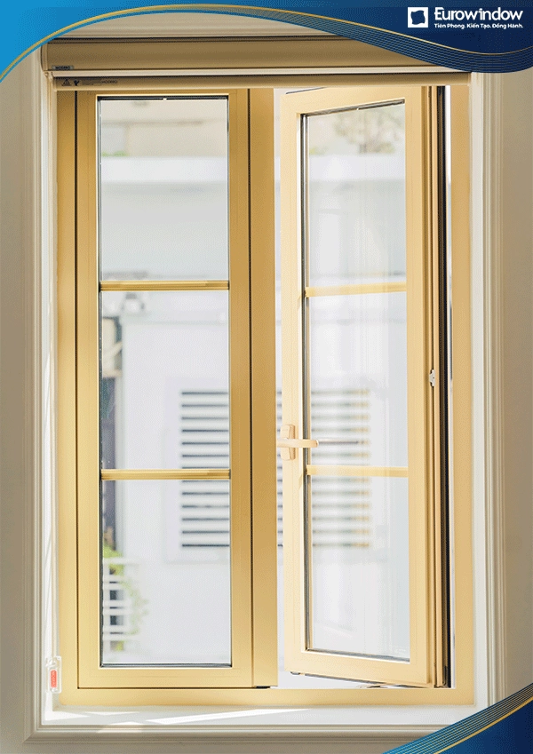 Cửa sổ mở quay ngoài 2 cánh màu vàng được Eurowindow thi công tại phòng ngủ của nhà ở thông dụng