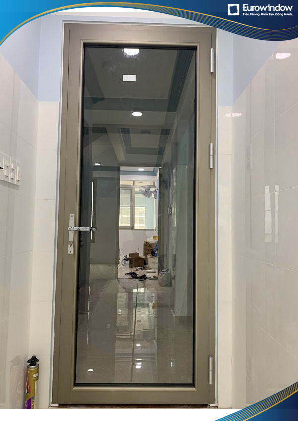 Cửa nhôm 1 cánh màu vàng sampanh kính trong suốt