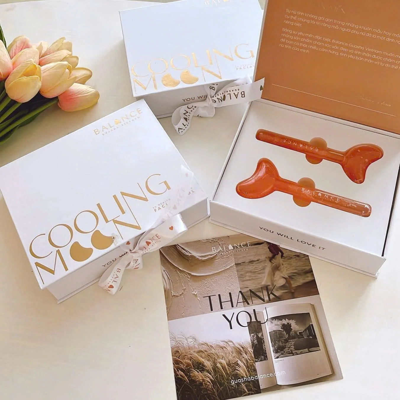 Gift set with orange guasha tools and packaging