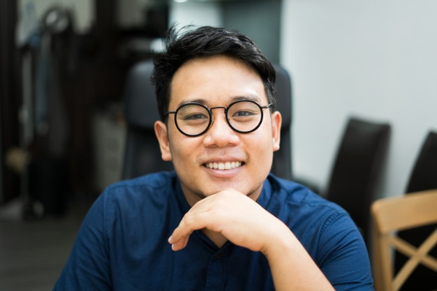 close-up-young-asian-man-wearing-glasses-208349-51